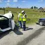Police officers are investigating the site of a crash between the white Toyota of eight-time world rally champion Sebastien Ogier and co-driver Vincent Landais, right, and local residents' Ford, left, that collided head-on on a local road near the village of Wlosty, near Goldap in northeastern Poland, Tuesday, June 25, 2024, while the Ogier and Landais were on a reconnaissance run ahead of this week's Rally Poland. Ogier and the Ford's driver were airlifted to hospital while Landais and the Ford's female passenger were taken by ambulances. (Police Office in Goldap via AP Photo)