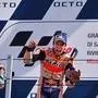 Race winner Repsol Honda Team Spanish rider, Marc Marquez (C) celebrates on the podium next to second-placed Petronas Yamaha SRT French rider, Fabio Quartararo following the San Marino MotoGP Grand Prix race at the Misano World Circuit Marco Simoncelli on September 15, 2019. (Photo by Marco Bertorello / AFP)