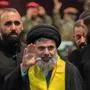 (FILES) Senior Hezbollah official Hashem Safieddine (C) attends the funeral ceremony of slain top commander Fuad Shukr in Beirut's southern suburbs on August 1, 2024. A high-level Hezbollah source said on October 5, 2024 that contact with Hashem Safieddine, widely touted as potentially the group's next leader, had been lost following Israeli strikes this week. (Photo by Khaled DESOUKI / AFP)