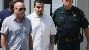 Kilmar Abrego Garcia, center, leaves the Putnam County Jail, Friday, Aug. 22, 2025, in Cookeville, Tenn. (AP Photo/Brett Carlsen)