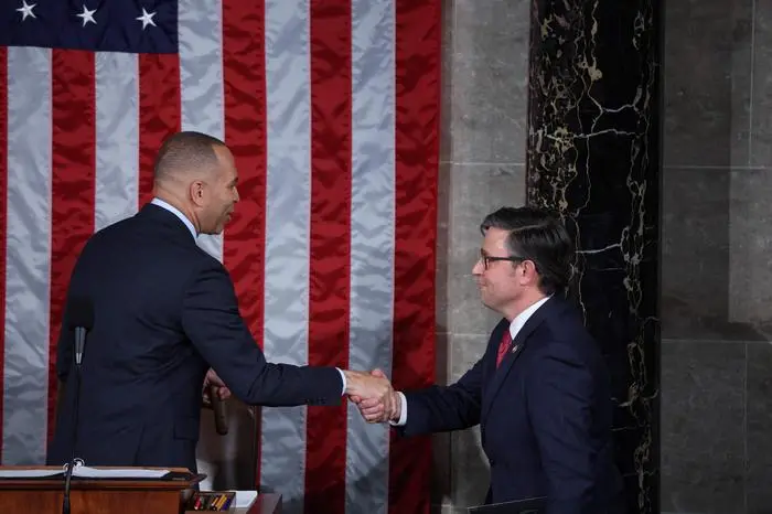 Newly elected House Speaker Mike Johnson shakes hands with House Minority Leader Hakeem Jeffries at the US Capitol in Washington, DC, on October 25, 2023. Republicans finally rallied behind a new standard-bearer Wednesday as the US House of Representatives elected its 56th speaker -- ending weeks of party infighting that paralyzed Congress in a period of international and domestic crisis. Louisiana's Mike Johnson, a staunch ally of Donald Trump and who spearheaded legal efforts to overturn the 2020 election, won unanimous support from his party to lead the lower chamber of Congress and draw a line under the chaos. (Photo by TOM BRENNER / AFP)