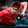 China's Wang Chuqin plays a return to Sweden's Truls Moregard during their men's table tennis singles round of 32 at the Paris 2024 Olympic Games at the South Paris Arena in Paris on July 31, 2024. (Photo by JUNG Yeon-je / AFP)