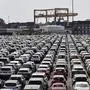 New cars are stored at the 'logport' (logistic port) in Duisburg, Germany, Wednesday, June 3, 2020. The car industry is expecting help by the German government because ot the economy crisis due to the coronavirus pandemic. (AP Photo/Martin Meissner)