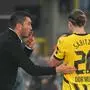 Borussia Dortmund's Turkish coach Nuri Sahin (L) speaks with Borussia Dortmund's Austrian midfielder #20 Marcel Sabitzer during the UEFA Champions League's 1st round day 1 football match between Club Brugge KV and Borussia Dortmund at the Jan Breydel Stadium in Bruges on September 18, 2024. (Photo by NICOLAS TUCAT / AFP)