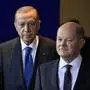 German Chancellor Olaf Scholz (R) and Turkish President Recep Tayyip Erdogan arrive to address a joint press conference before talks at the Chancellery in Berlin on November 17, 2023. (Photo by Tobias SCHWARZ / AFP)