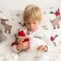 Beautiful blond toddler child, sick boy with fever, lying in bed on Christmas, coughing and having running nose