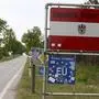 A sign written on "Republic of Austria" stands at the closed border crossing from Austria to the Czech Republic near Reinthal, Austria, Wednesday, May 13, 2020. The Austrian government has moved to restrict freedom of movement for people, in an effort to slow the onset of the COVID-19 coronavirus. (AP Photo/Ronald Zak)