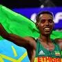Ethiopia's Lelisa Desisa celebrates after winning in the Men's Marathon at the 2019 IAAF Athletics World Championships in Doha in the night between October 5, 2019 and October 6, 2019. (Photo by Giuseppe CACACE / AFP)