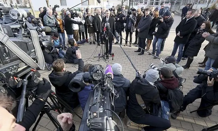 Norbert Hofer of Austria's Freedom Party, FPOE, speakes to press after casting his vote during the Austrian presidential elections, in Pinkafeld, Austria, Sunday, Dec. 4, 2016. (AP Photo/Ronald Zak)