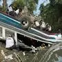 Volunteer firefighters work at the scene of an accident in which a bus fell down a ravine in Guatemala City on February 10, 2025. A bus carrying 75 people plunged into a ravine in Guatemala City on Monday, killing at least 31 people, rescue workers said. (Photo by Johan ORDONEZ / AFP)
