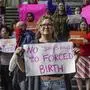Supporters of abortion rights gather for a protest at the Indiana Federal Courthouse in Indianapolis, Tuesday, May 3, 2022, in response to the news that the U.S. Supreme Court could be poised to overturn the landmark Roe v. Wade case that legalized abortion nationwide. (Michelle Pemberton/The Indianapolis Star via AP)