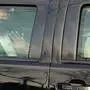TOPSHOT - US President Trump waves from the back of a car in a motorcade outside of Walter Reed Medical Center in Bethesda, Maryland on October 4, 2020. (Photo by ALEX EDELMAN / AFP)