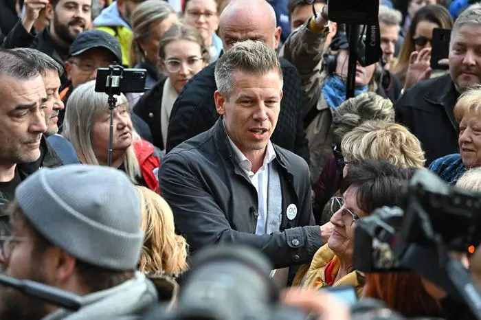 Peter Magyar, Hungarian opposition figure, talks to people prior to their demonstration against the child protection policy of the Hungarian government in front of the Interior Ministry in Budapest on April 26, 2024. (Photo by ATTILA KISBENEDEK / AFP)