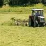 THEMENBILD - ein Landwirt mit Traktor und Maehwerk beim Heuwenden, aufgenommen am 10. Juli 2015, Leogang, Österreich// a farmer with tractor and mower, turn around the hay, Leogang, Austria on 2015/07/10. EXPA Pictures © 2015, PhotoCredit: EXPA/ JFK