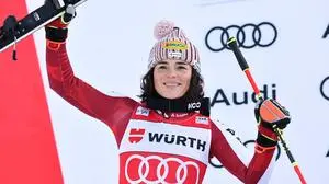 Austria's Julia Scheib celebrates on podium her second place in a alpine ski, women's World Cup giant slalom in Kranjska Gora, Slovenia, Saturday, Jan. 3, 2026. (AP Photo/Marco Trovati)