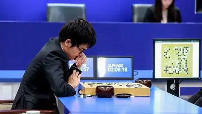 (FILES) This file photo taken on May 25, 2017 shows China's 19-year-old Go player Ke Jie preparing to make a move during the second match against Google's artificial intelligence programme AlphaGo in Wuzhen, eastern China's Zhejiang province..The Google-owned computer algorithm AlphaGo is retiring from playing humans in the ancient Chinese game of Go after roundly defeating the world's top player this week, its developer said May 27, 2017. / AFP PHOTO / STR / China OUT
