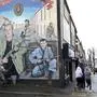 A loyalist mural is seen on a wall in west Belfast, Northern Ireland, Wednesday, April 5, 2023. It has been 25 years since the Good Friday Agreement largely ended a conflict in Northern Ireland that left 3,600 people dead. (AP Photo/Peter Morrison)