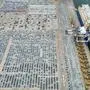 This aerial photo taken on August 7, 2022 shows newly-produced vehicles to be exported at a port in Yantai in China's eastern Shandong province. (Photo by AFP) / China OUT