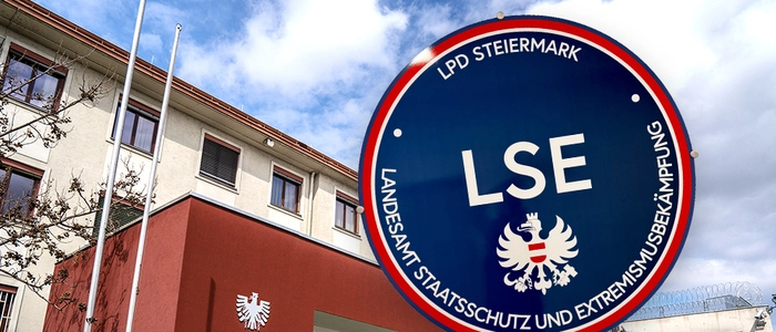 Bild zeigt Eingang der Justizanstalt Graz-Karlau und ein blaues LSE-Logo