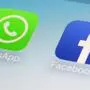 FILE - This Feb. 19, 2014, file photo, shows WhatsApp and Facebook app icons on a smartphone in New York. WhatsApp says on Tuesday, April 5, 2016,  it's now using a powerful form of encryption to protect the security of photos, videos, group chats and voice calls in addition to text messages sent by more than a billion users around the globe. (AP Photo/Patrick Sison, File)