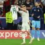 Hungary's forward #23 Kevin Csoboth holds Hungary's forward #19 Barnabas Varga's jersey to celebrate scoring his team's first goal during the UEFA Euro 2024 Group A football match between Scotland and Hungary at the Stuttgart Arena in Stuttgart on June 23, 2024. (Photo by LLUIS GENE / AFP)