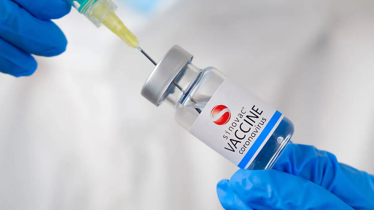 Sinovac coronavirus Vaccine and syringe in the bottle or vial for injection in doctors hands. Covid-19, SARS-Cov-2 prevention, January 2021, San Francisco, USA.