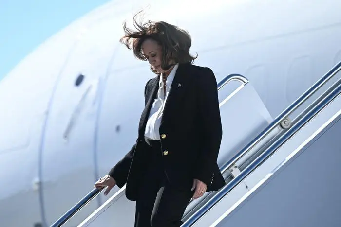 TOPSHOT - US Vice President and Democratic presidential candidate Kamala Harris arrives at Pitt-Greenville Airport in Greenville, North Carolina, on October 13, 2024, for a campaign event. (Photo by Brendan SMIALOWSKI / AFP)