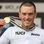 (FILES) This photo taken on September 25, 2019 shows Australian cyclist Rohan Dennis celebrating on the podium after winning  the Elite Men Individual Time Trial at the 2019 UCI Road World Championships in Harrogate, northern England. Former world champion cyclist Rohan Dennis has been charged over the death of his Olympian wife, Australian media reported on January 1. 2024, after allegedly hitting her with a car. (Photo by Oli SCARFF / AFP)
