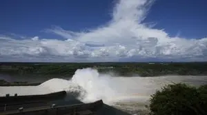 FILE - Water flows at the Itaipu hydroelectric dam on the shared border of Paraguay with Brazil, in Hernandarias, Paraguay, March 16, 2023. (AP Photo/Jorge Saenz, File)