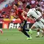 Spain's midfielder Sergio Busquets (L) is challenged by Portugal's defender Jose Fonte during the international friendly football match between Spain and Portugal at the Wanda Metropolitano stadium in Madrid in preperation for the UEFA European Championships, on June 4, 2021. (Photo by JAVIER SORIANO / AFP)