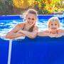 happy active mother and child in swimming pool relaxing