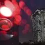 In this Dec. 13, 2017 photo the red lighting of barriers at the European Central Bank and rain drops on the lens create round reflections in Frankfurt am Main, 'Germany. Europe's highest monetary authorities meet again on Dec. 14, 2017. (Arne Dedert/dpa via AP)