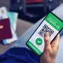vaccinated person using digital health passport app in mobile phone for travel during covid-19 pandemic