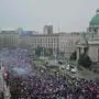 Protestors take part in one of the largest anti-corruption protests since the anti-graft movement, in front of the National Assembly bulilding in Belgrade on March 15, 2025. Tens of thousands of protesters converge in Serbia's capital Belgrade on March 15, 2025, the latest in a series of anti-corruption demonstrations to upend the Balkan country in recent months after 15 people were killed when a railway station roof collapsed in the city of Novi Sad in November 2024. (Photo by Andrej ISAKOVIC / AFP)
