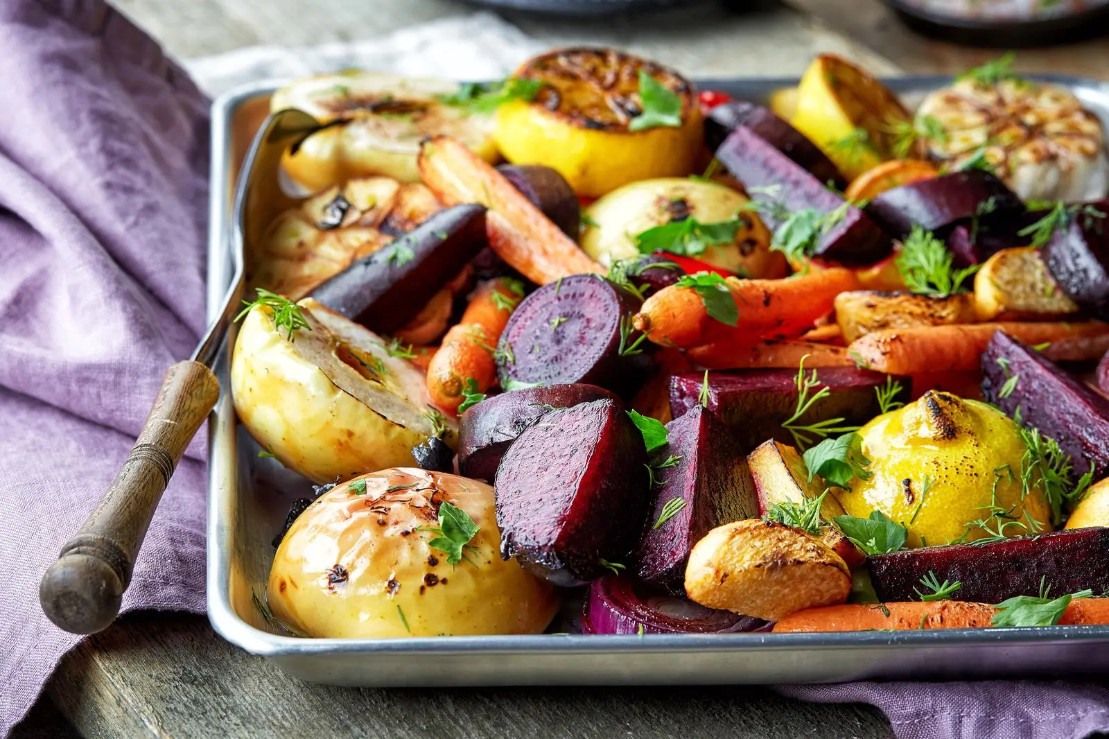 Roasted fruits and vegetables on wooden table
