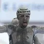 Sonny Colbrelli of Italy crosses the finish line to win the men's Paris Roubaix, a 258 kilometer (160.3 miles) one-day-race cycling race, at the velodrome in Roubaix, northern France, Sunday, Oct. 3, 2021. (AP Photo/Michel Spingler)