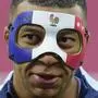 France's Kylian Mbappe wears a face mask as he runs during a training session in Leipzig, Germany, Thursday, June 20, 2024. France will play against Netherland during their Group D soccer match at the Euro 2024 soccer tournament on June 21. (AP Photo/Hassan Ammar)