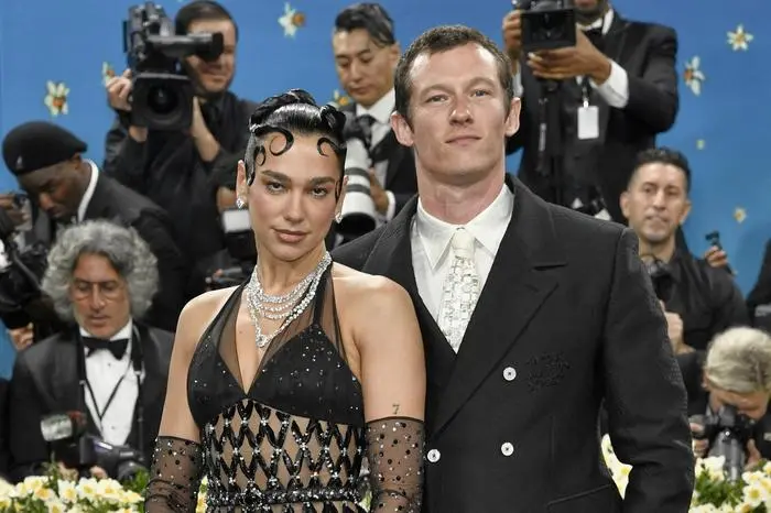 FILE - Dua Lipa, left, and Callum Turner attend The Metropolitan Museum of Art's Costume Institute benefit gala on May 5, 2025, in New York. (Photo by Evan Agostini/Invision/AP, File)