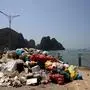 (FILES) In this file photo taken on May 17, 2023 a pile of trash is collected from Ha Long Bay in northeast Vietnam. More than seven million visitors came to visit the spectacular limestone karsts of Ha Long Bay, on Vietnam's northeastern coast, in 2022. Authorities hope that number will jump to eight and a half million this year. But the site's popularity, and the subsequent rapid growth of Ha Long City -- which is now home to a cable car, amusement park, luxury hotels and thousands of new homes -- severely damaged the ecosystem of the water. (Photo by Nam NGUYEN / AFP)