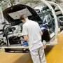 Employees work at  at the assembly  line for the Golf VII  at the  VW plant  in Wolfsburg, Germany Wednesday Oct. 21, 2015.  ( Julian Stratenschulte/Pool Photo via AP)