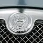 The hood ornament and a portion of the grill of a Jaguar automobile appears at a dealership, in Norwood, Mass., Wednesday, March 26, 2008. Ford Motor Co. is selling its storied Jaguar and Land Rover businesses to India's Tata Motors Ltd. in a deal that will net the U.S. automaker $1.7 billion, roughly a third of the price it paid for the two luxury brands.(AP Photo/Steven Senne), sujet logo