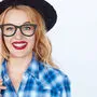 Nerdy fashion hipster wearing a hat and blue shirt