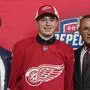 Marco Kasper wears a Detroit Red Wings jersey after being selected in the NHL hockey draft in Montreal on Thursday, July 7, 2022. (Ryan Remiorz/The Canadian Press via AP)