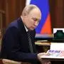March 12, 2025, Moscow, Moscow Oblast, Russia: Russian President Vladimir Putin, left, reads a report as he listens to Arkhangelsk Region Governor Alexander Tsybulsky, right, during a face-to-face meeting at the Kremlin, March 12, 2025 in Moscow, Russia. Moscow Russia - ZUMAp138 20250312_zaa_p138_003 Copyright: xMikhailxMetzel/KremlinxPoolx