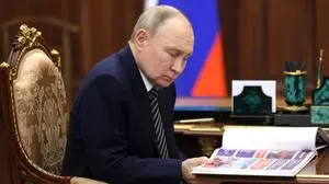March 12, 2025, Moscow, Moscow Oblast, Russia: Russian President Vladimir Putin, left, reads a report as he listens to Arkhangelsk Region Governor Alexander Tsybulsky, right, during a face-to-face meeting at the Kremlin, March 12, 2025 in Moscow, Russia. Moscow Russia - ZUMAp138 20250312_zaa_p138_003 Copyright: xMikhailxMetzel/KremlinxPoolx