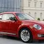 Ein rotes Exemplar des Volkswagen-Modells New Beetle steht am Montag (11.07.11) in Berlin bei einer Pressepraesentation. VW praesentierte den modernen Nachfolger des legendaeren VW Kaefers, der ab Herbst 2011 im Handel vertrieben werden soll. (zu dapd-Text) Foto: Berthold Stadler/dapd