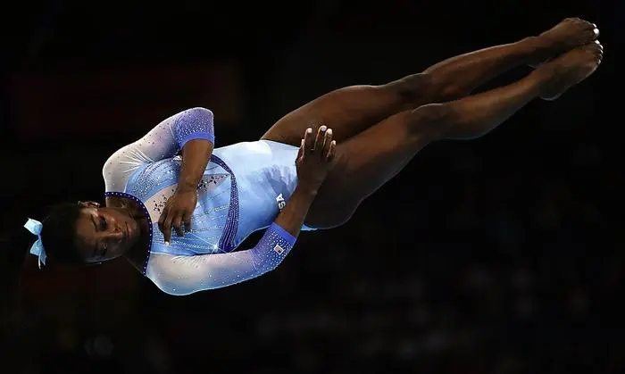 USA's Simone Biles performs during the women's qualifying session at the FIG Artistic Gymnastics World Championships at the Hanns-Martin-Schleyer-Halle in Stuttgart, southern Germany, on October 5, 2019. (Photo by Lionel BONAVENTURE / AFP)