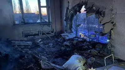 This photo provided by the Ukrainian Police Press Service shows an apartment damaged by Russian drone during air attack in Chernyhiv, Ukraine, on Christmas Eve, Wednesday, Dec. 24, 2025. (Ukrainian Police Press Service via AP)