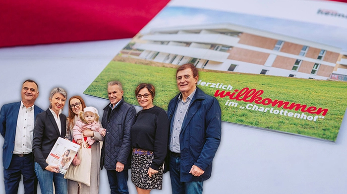V.l. Helmut Kusternik, Gaby Schaunig, Mieterin Iryna Kysel mit Emylia, Ferdinand Vouk, Beate Prettner und Günther Goach