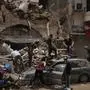 FILE - People remove debris from a house damaged by a massive explosion in the seaport of Beirut, on Aug. 7, 2020. (AP Photo/Felipe Dana, File)